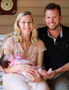 Brock and I holding Ashlynn, August 2018.